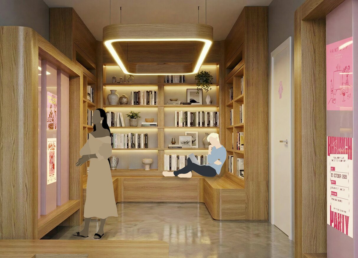 Biblioteca y sala común de La Plaza Viva, con un muro de carteles de eventos al fondo