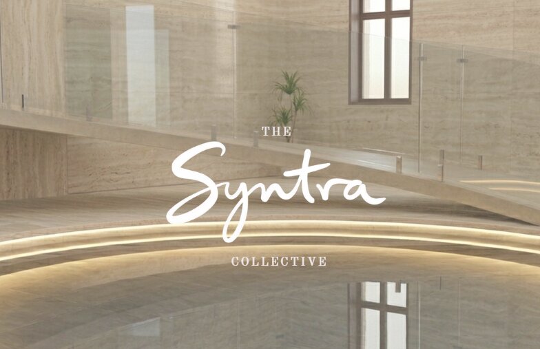 Rendered interior of The Syntra Collective’s pool hall in travertine stone, with a glowing helical staircase